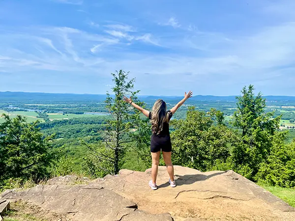 Sarry San overlooking a mountain landscape